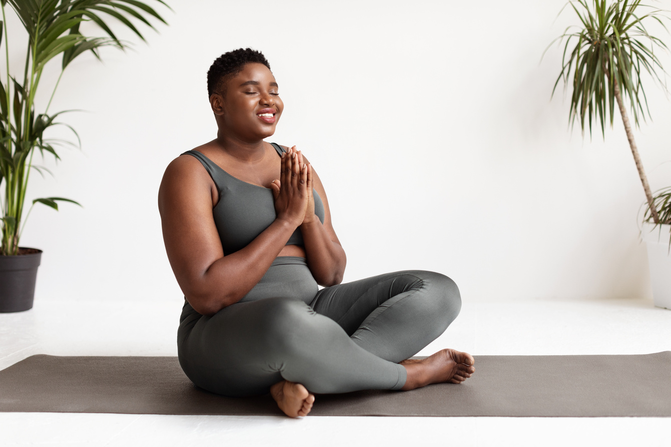 Relaxed  African American Woman in Sports Outfit Meditating